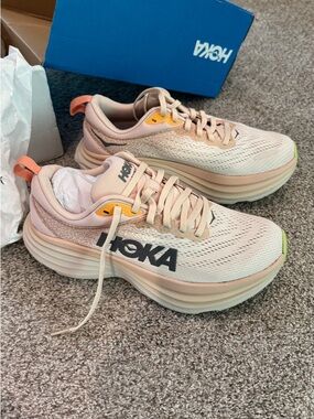 Hoka Women's Clifton Edge Running Shoes in Peach and Yellow Accents